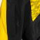 Chubasquero deportivo hombre/niño Champions VIii. Color negro/amarillo.