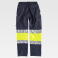 Pantalón softshell alta visibilidad multibolsillos unisex S9820. Color azul marino/amarillo a. V..